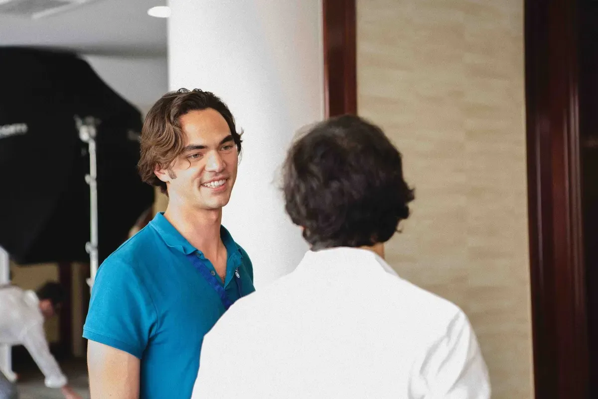 An instructor talking with a colleague